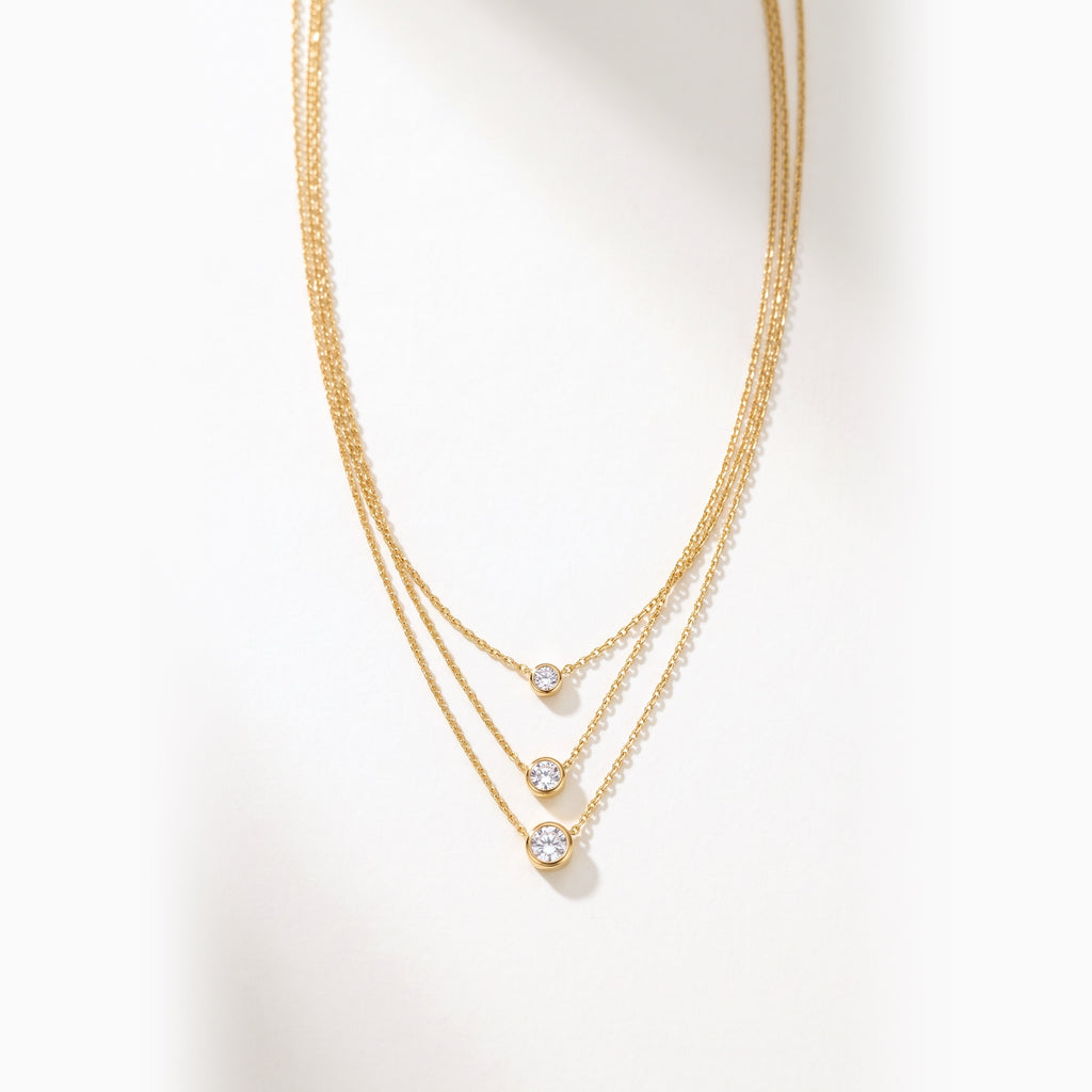 Collana Tre Luci, finitura dorata — foto prodotto