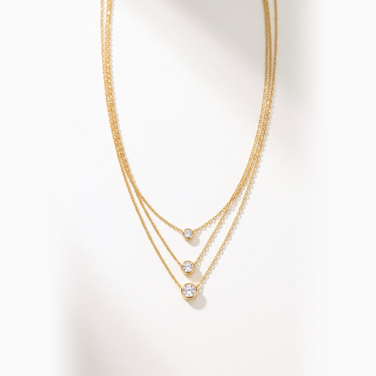 Collana Tre Luci, finitura dorata — foto prodotto